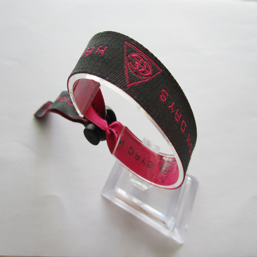 woven wristband with reusable plastic spring accessory