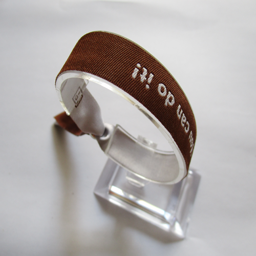 woven wristband with reusable metal bead