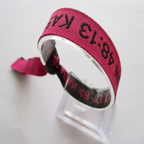 woven wristband with reusable plastic bead