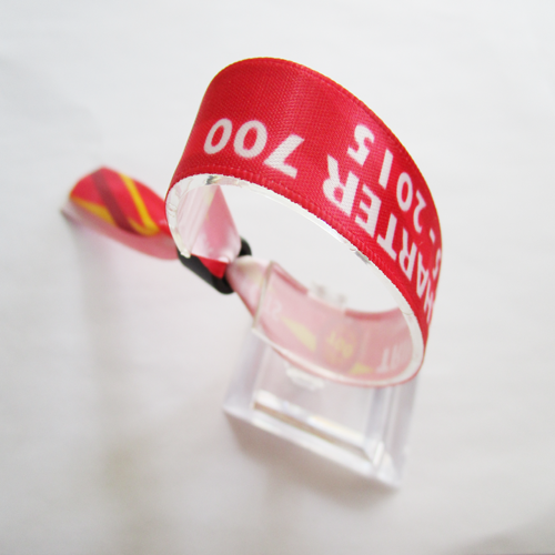 satin wristband with one time use plastic sild closure with metal teeth inside