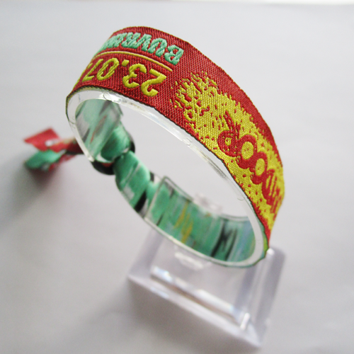 woven wristband with one time use plastic round slid closure