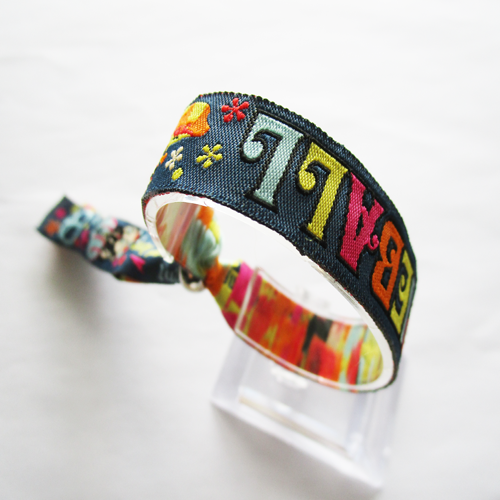 woven wristband with reusable use metal ring